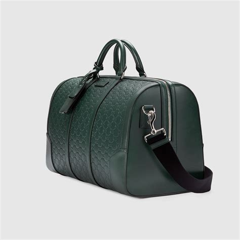 signiture leather gucci duffle|Gucci large duffle bag.